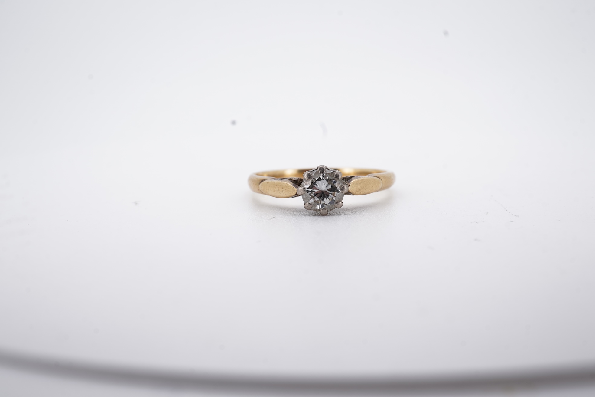 An 18ct and solitaire diamond set ring, the stone weighing approximately 0.30ct, size N, gross weight 2.8 grams.